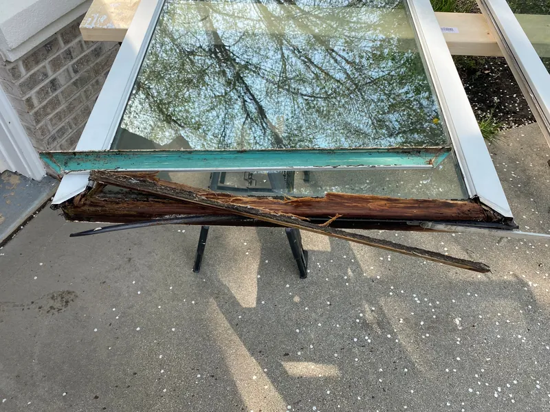 Rotted bottom rail of a clad casement sash