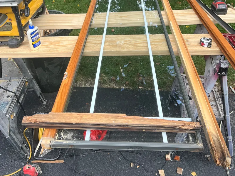 Casement sash taken apart, with the rotted stile removed and new wood ready