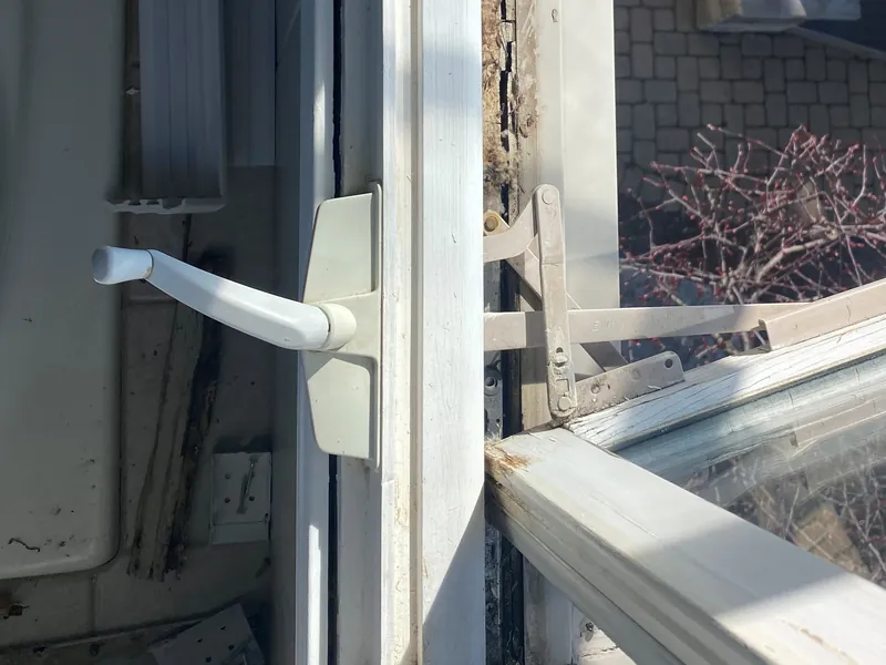 Casement window crank operator and arm, close-up