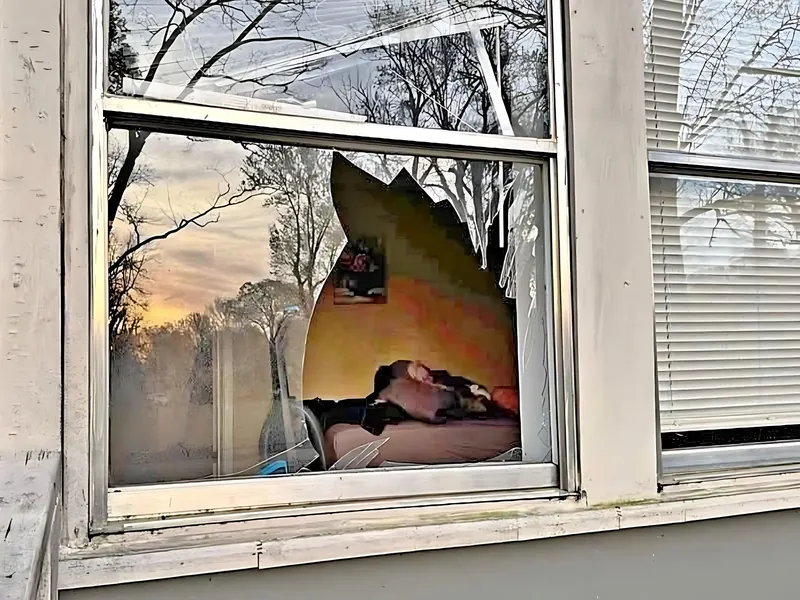 Broken window with shattered glass, before it was secured